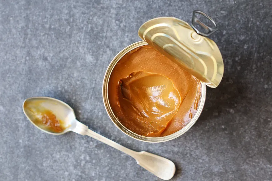 Dulce de leche in a metal tin can.